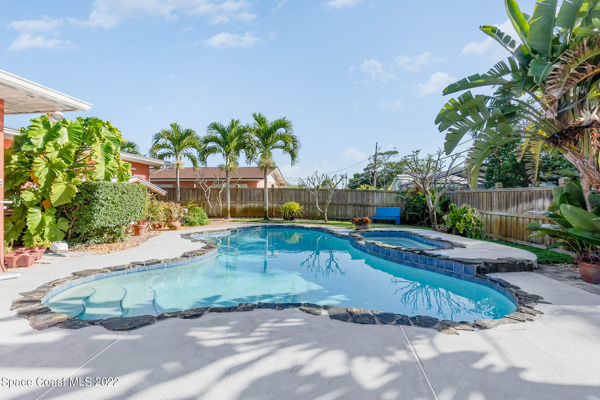 947 Santa Cruz Road Cocoa Beach, FL 32931 - Photo 8 of 29 a view of a swimming pool with a patio