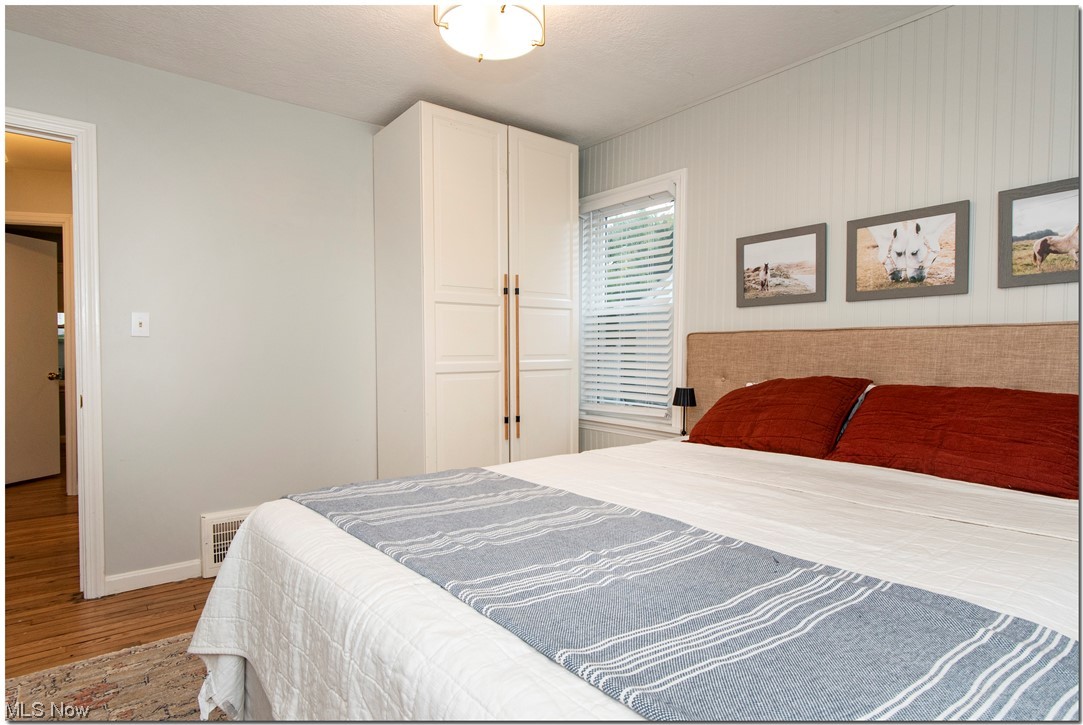 1430 West Miner Road Cleveland, OH 44124 - Photo 15 of 32 1st floor Bedroom featuring light hardwood floors