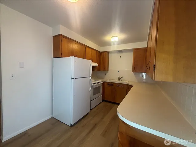 a refrigerator freezer sitting in a kitchen