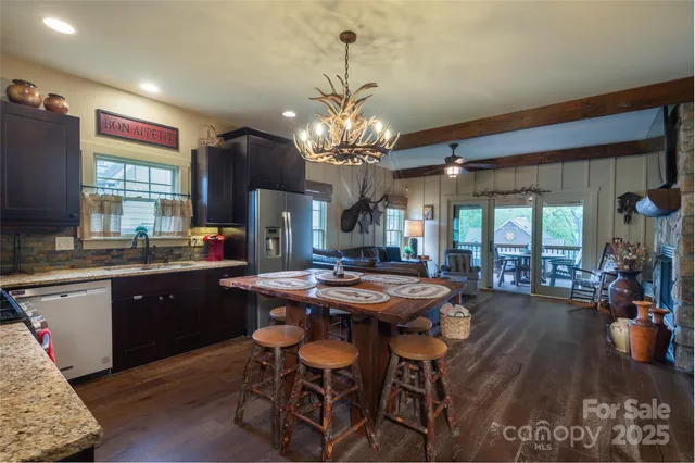 a kitchen with a table and chairs in it