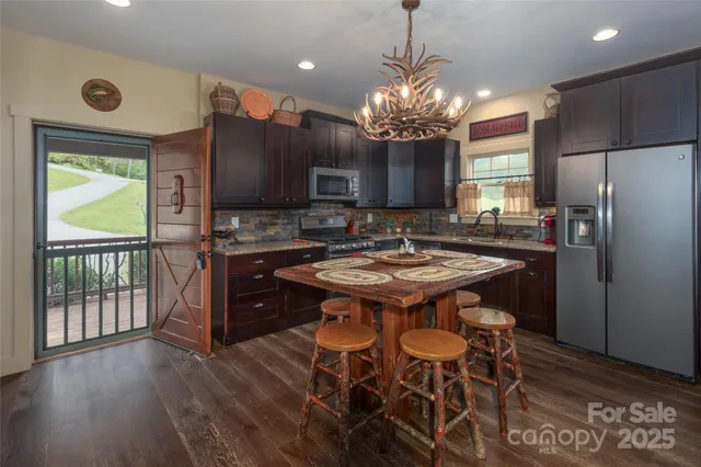 a kitchen with a table and chairs in it