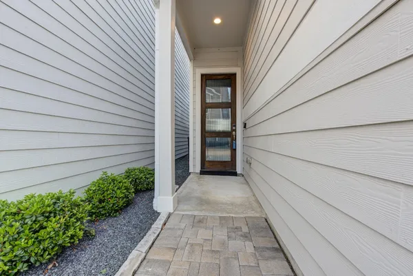 a view of a pathway besides a house