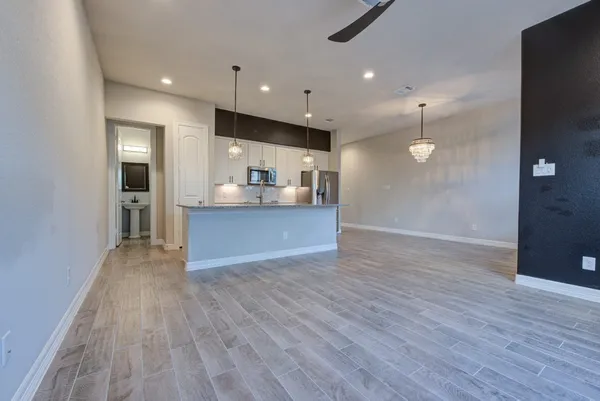 a view of kitchen with wooden floor and window