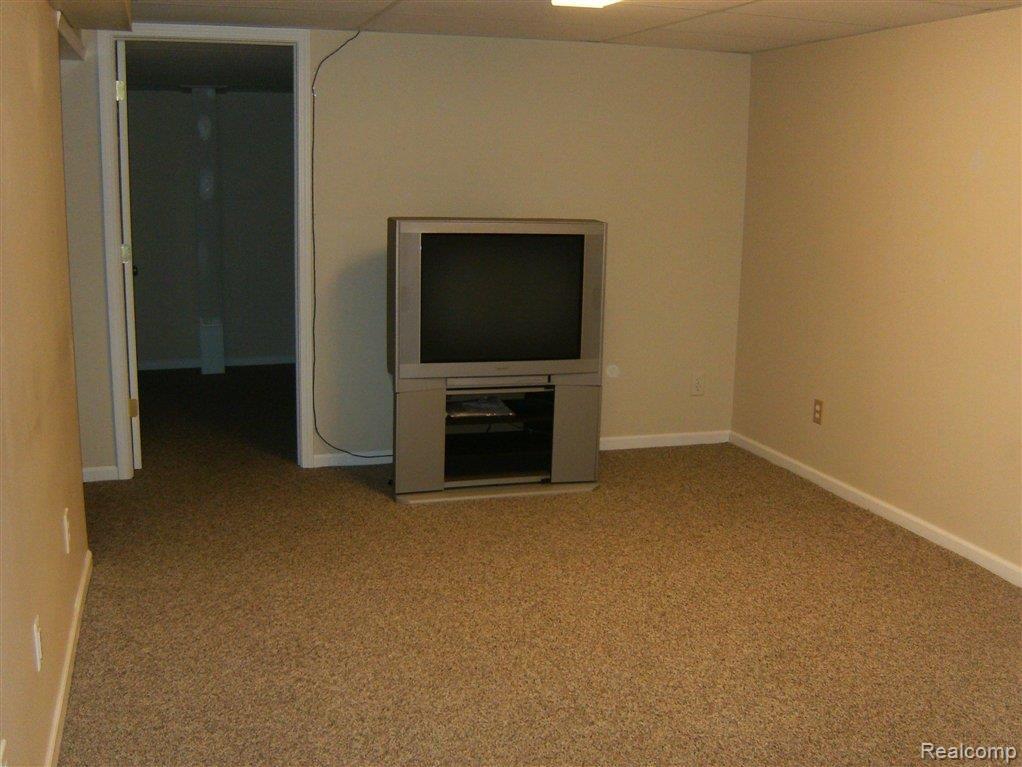 267 Marmoor Court, Unit 25 Rochester, MI 48309 - Photo 9 of 14 MARMOOR BASEMENT TV ROOM.JPG