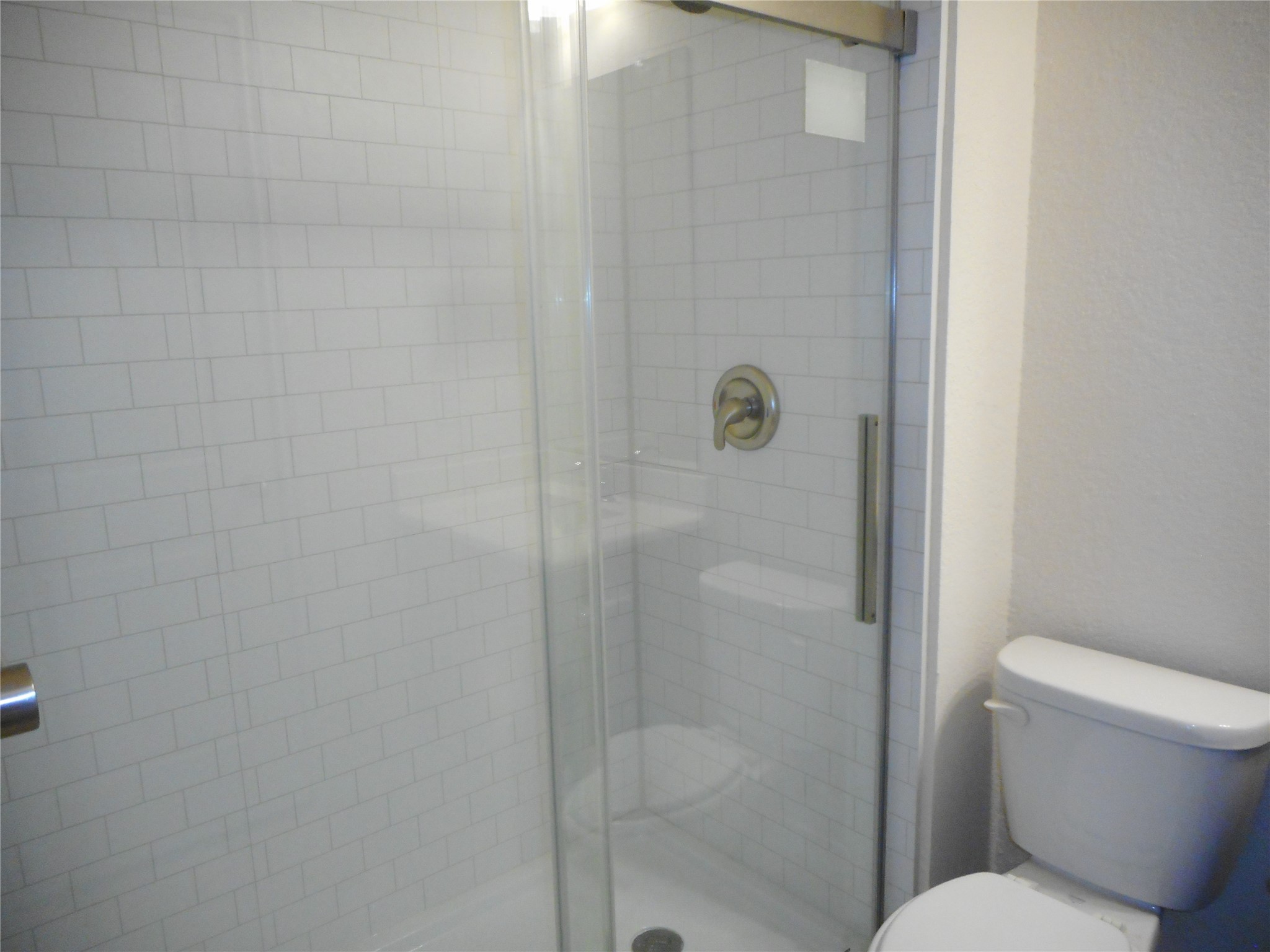 14021 Buffalo Gap Trail Conroe, TX 77384 - Photo 14 of 20 a bathroom with a toilet and a shower
