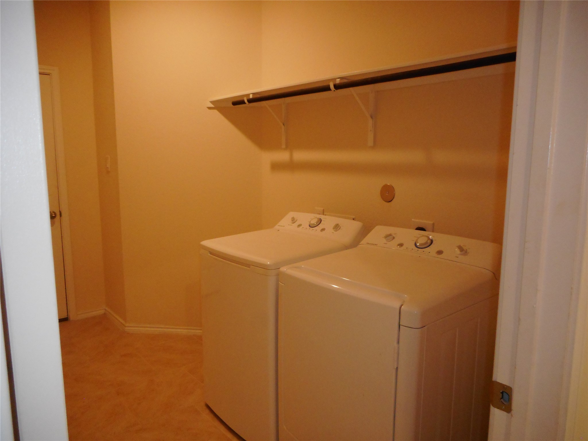 14021 Buffalo Gap Trail Conroe, TX 77384 - Photo 20 of 20 a utility room with dryer and washer