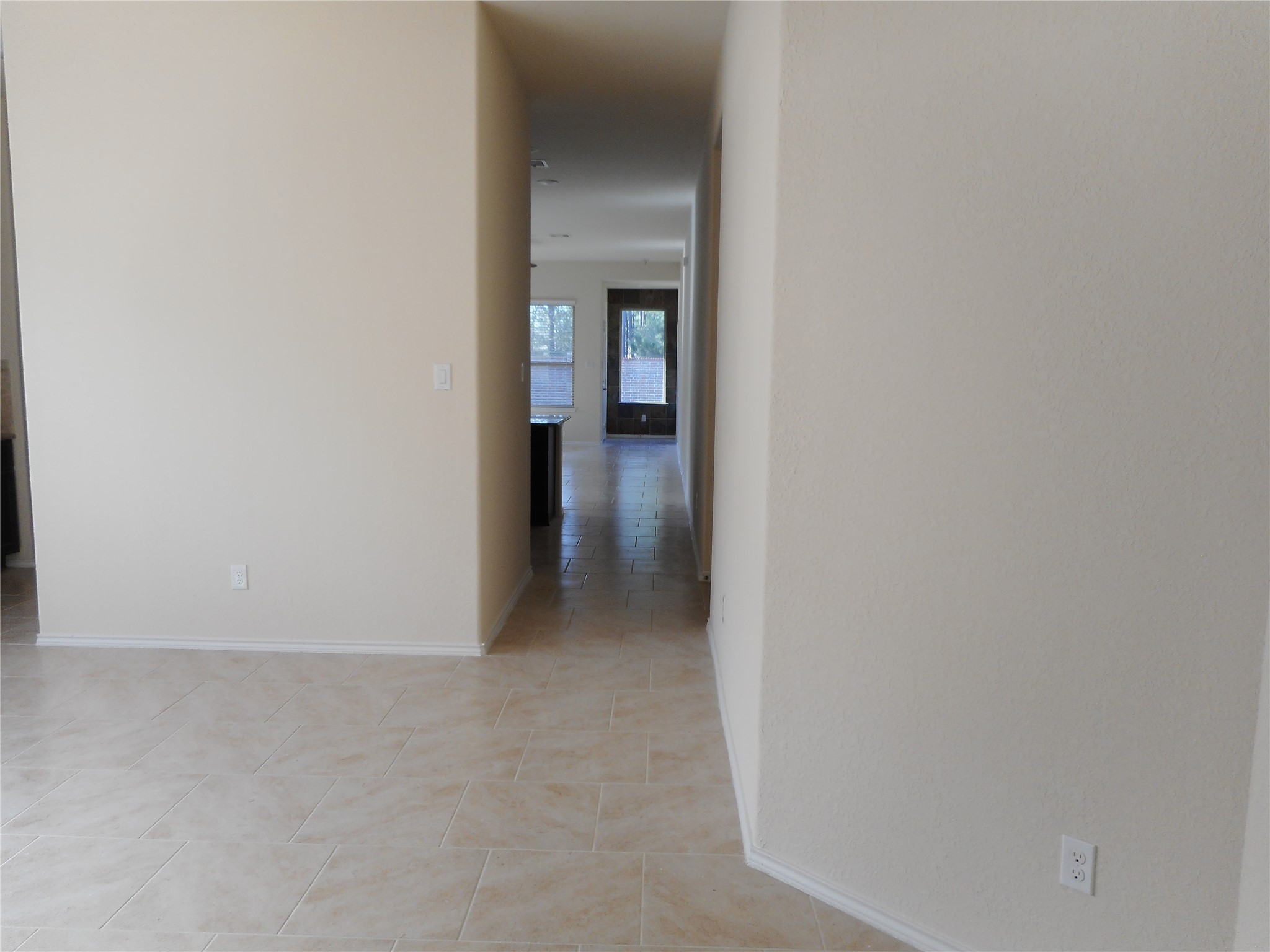 14021 Buffalo Gap Trail Conroe, TX 77384 - Photo 7 of 20 a view of a hallway with wooden floor