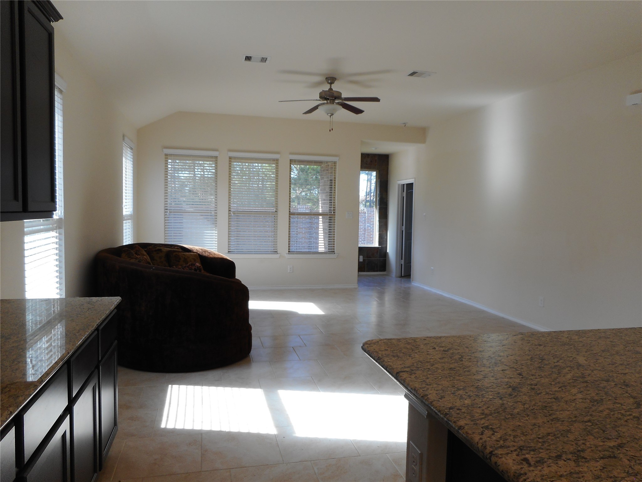 14021 Buffalo Gap Trail Conroe, TX 77384 - Photo 8 of 20 a living room with a couch and a chandelier