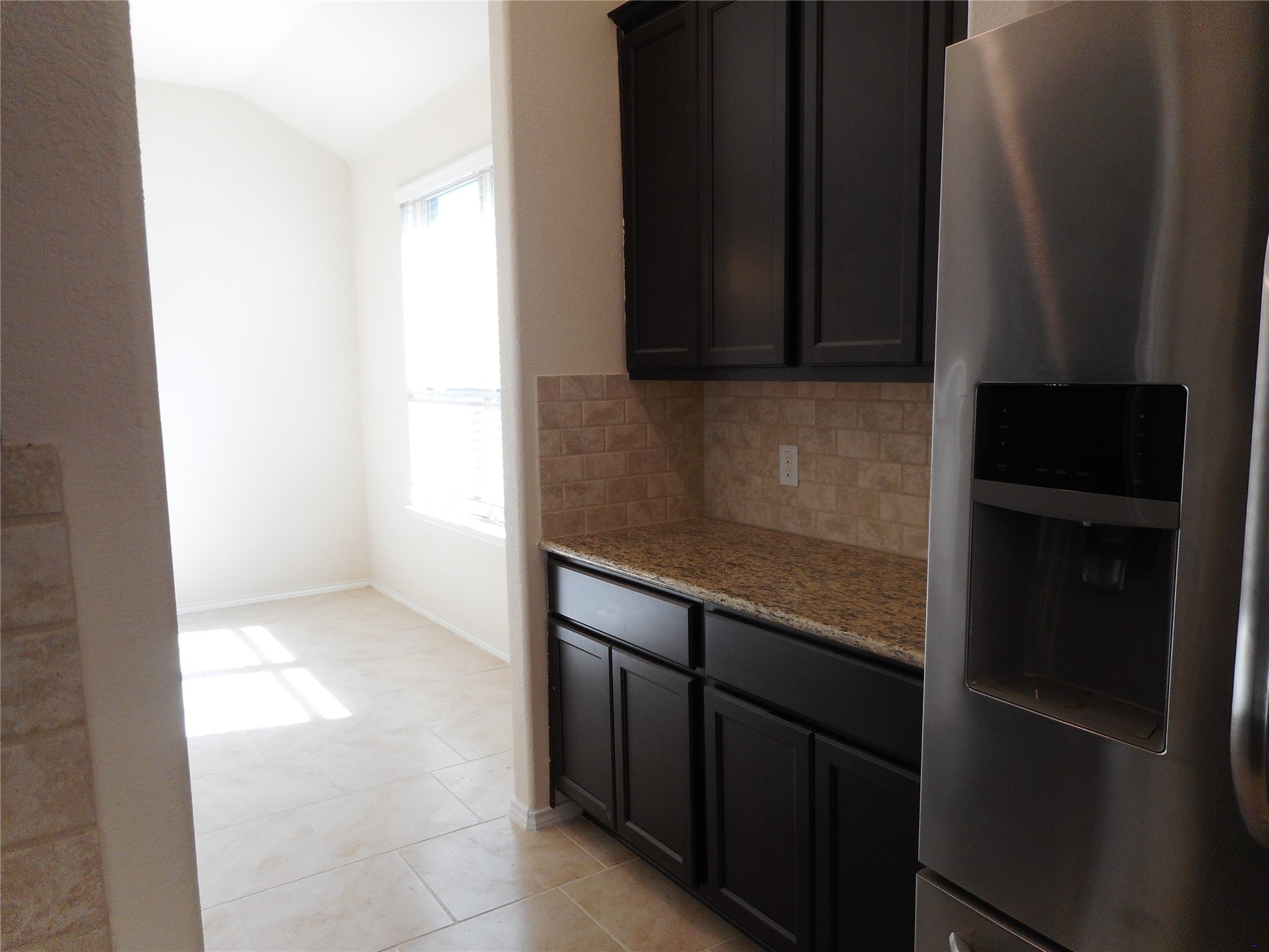 14021 Buffalo Gap Trail Conroe, TX 77384 - Photo 9 of 20 a kitchen with a sink and a microwave