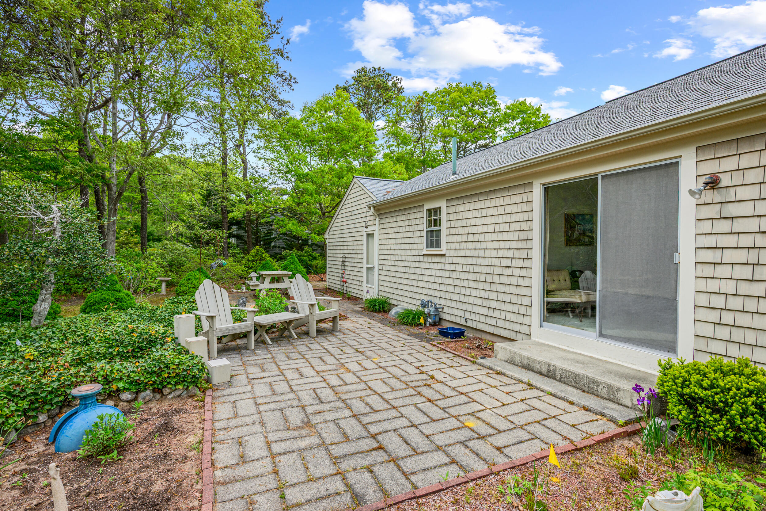 59 Beverly Road West Yarmouth, MA 02673 - Photo 8 of 33 a view of backyard with sitting area