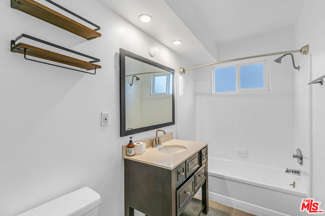 1837 North La Brea Avenue, Unit 2 Los Angeles, CA 90046 - Photo 13 of 19 a bathroom with a sink a toilet and shower
