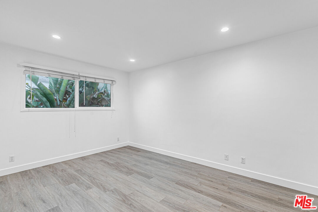 1837 North La Brea Avenue, Unit 2 Los Angeles, CA 90046 - Photo 14 of 19 a view of empty room with wooden floor and fan