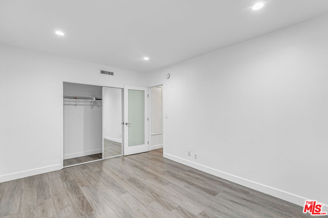 1837 North La Brea Avenue, Unit 2 Los Angeles, CA 90046 - Photo 15 of 19 a view of empty room with wooden floor and closet