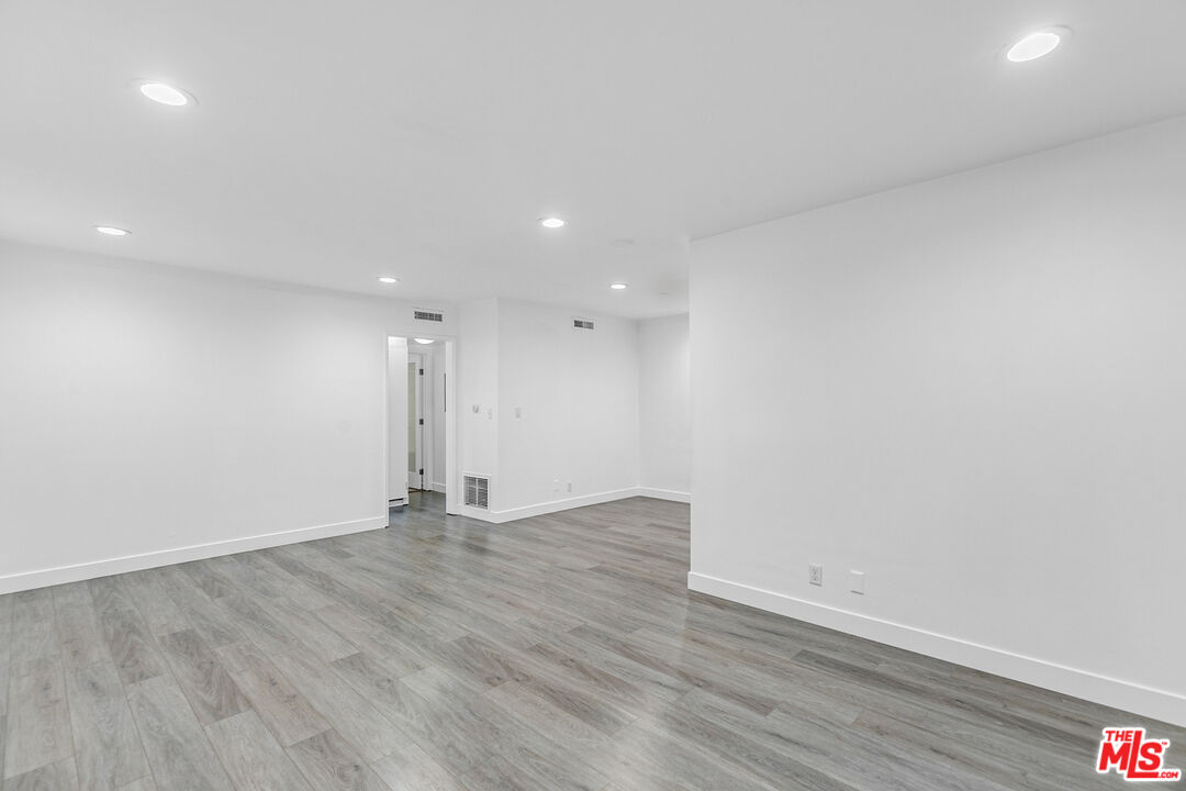 1837 North La Brea Avenue, Unit 2 Los Angeles, CA 90046 - Photo 7 of 19 a view of an empty room with wooden floor