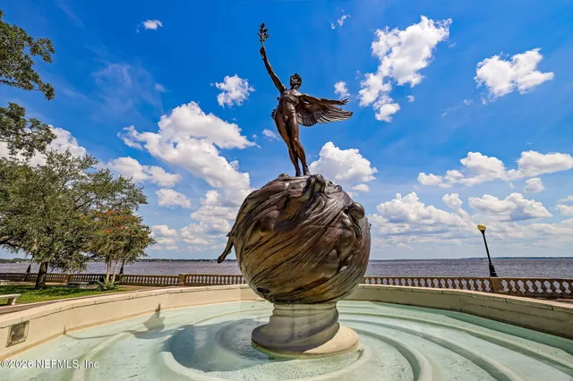 swimming pool with outdoor seating and plants