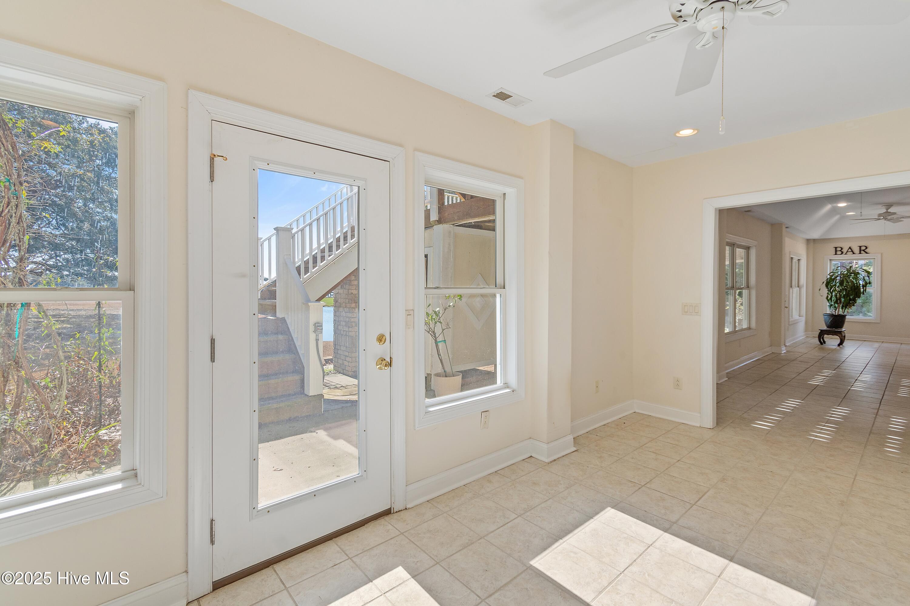 6777 Roberta Road Southwest Ocean Isle Beach, NC 28469 - Photo 58 of 89 1st Floor Great room with French dooes out to the patio