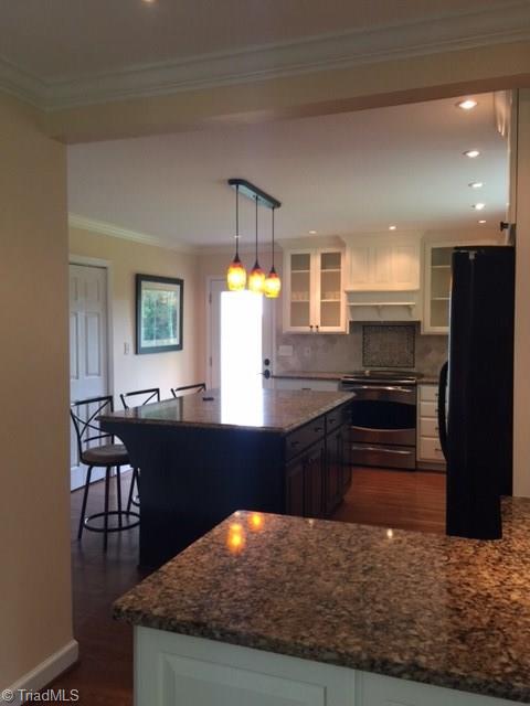 1020 Old Mail Rte Road King, NC 27021 - Photo 18 of 30 Looking into the kitchen from the Dining RoomQuartz Counters Gourmet Convection Range Bosch Dishwasher Island w seating