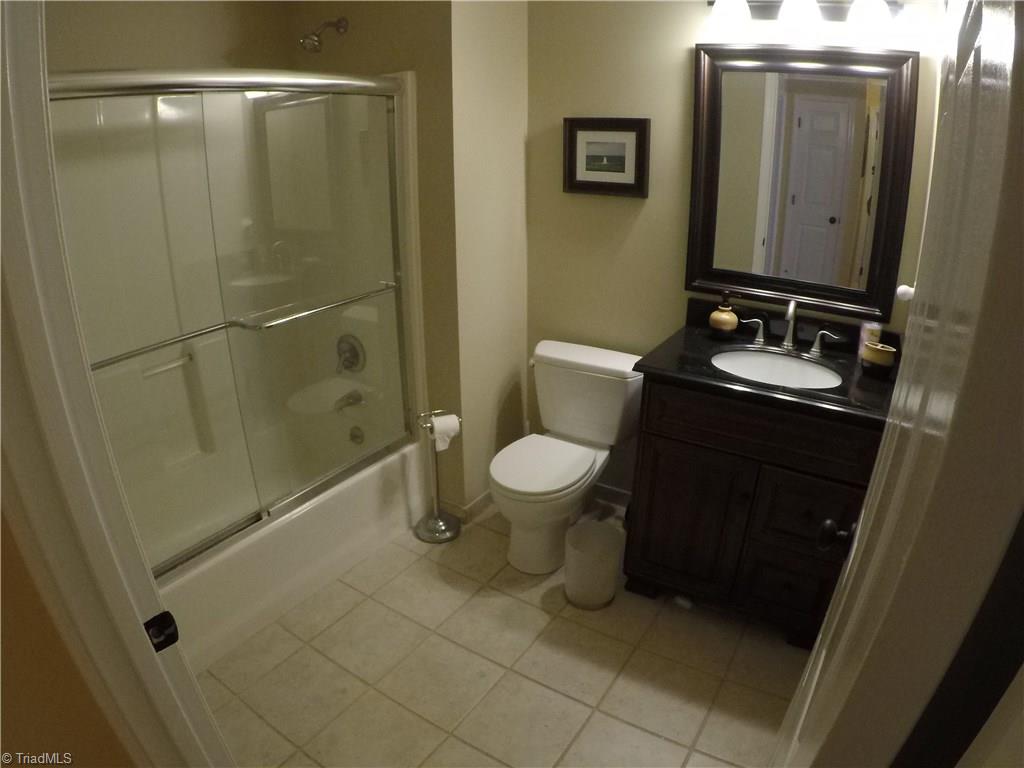 1020 Old Mail Rte Road King, NC 27021 - Photo 25 of 30 Full bath on upper in bedroom 1 has Italian Tile, Granite Vanity