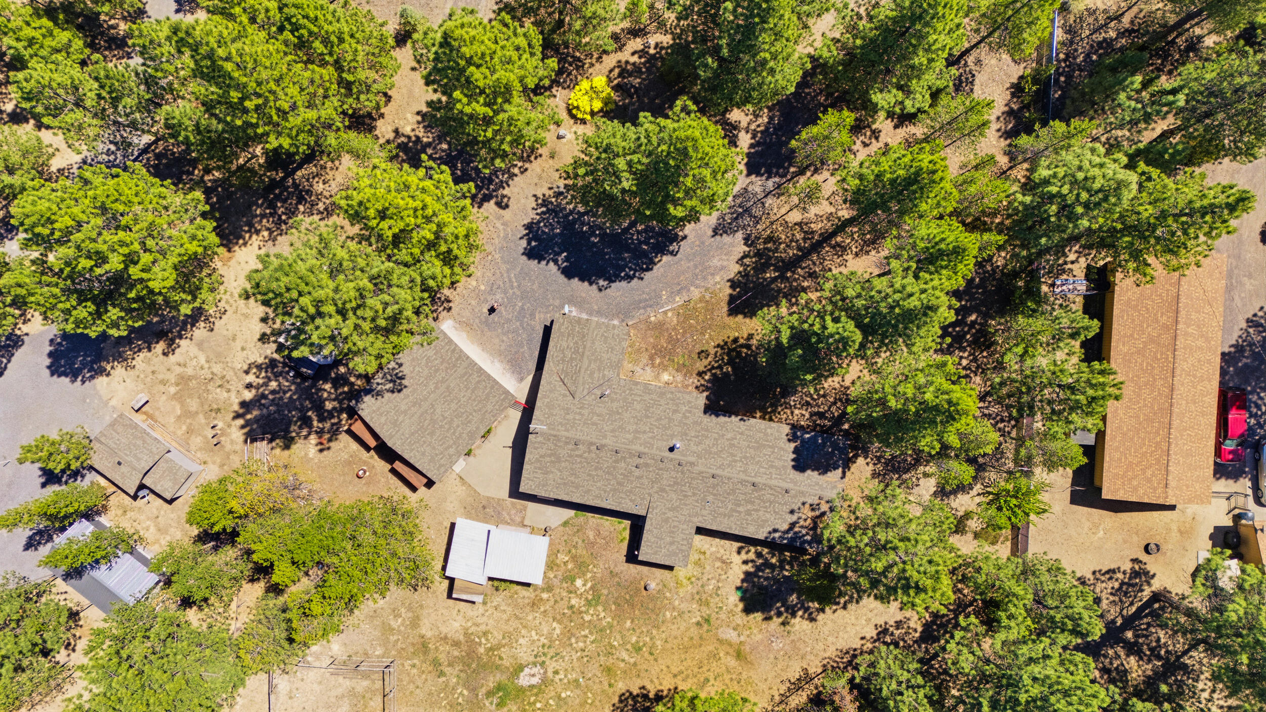 50868 Doe Loop La Pine, OR 97739 - Photo 38 of 51 an aerial view of a house with a yard and garden in the back