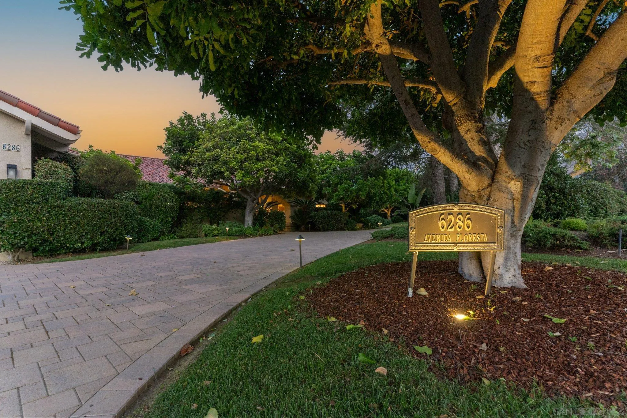 6286 Avenida Floresta Rancho Santa Fe, CA 92067 - Photo 14 of 69 a view of a backyard with table and chairs plants and trees