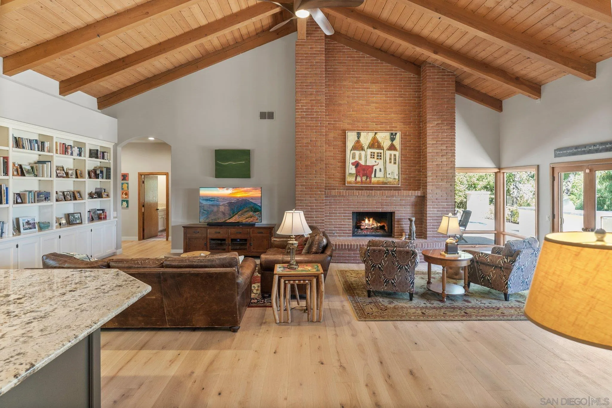 6286 Avenida Floresta Rancho Santa Fe, CA 92067 - Photo 15 of 69 a living room with fireplace furniture and a flat screen tv