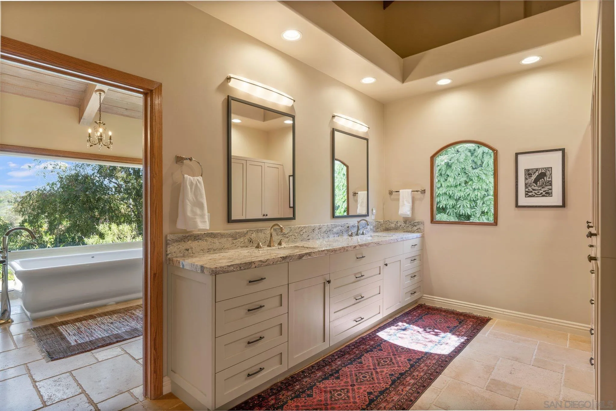 6286 Avenida Floresta Rancho Santa Fe, CA 92067 - Photo 23 of 69 a bathroom with a double vanity sink and a mirror