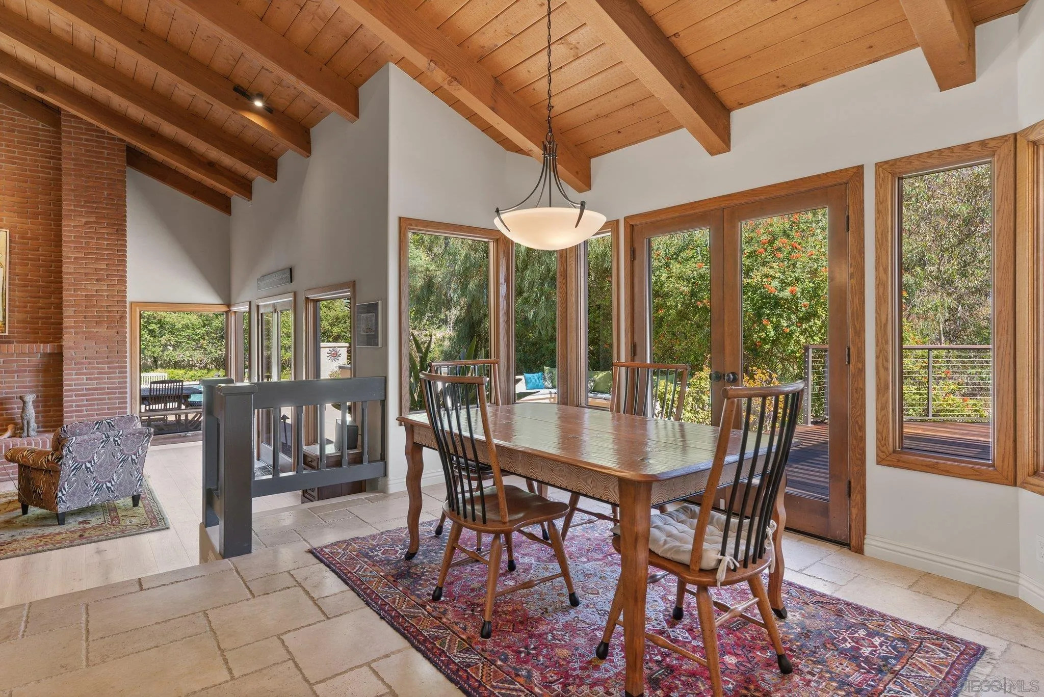 6286 Avenida Floresta Rancho Santa Fe, CA 92067 - Photo 39 of 69 a view of a dining room with furniture large windows and wooden floor