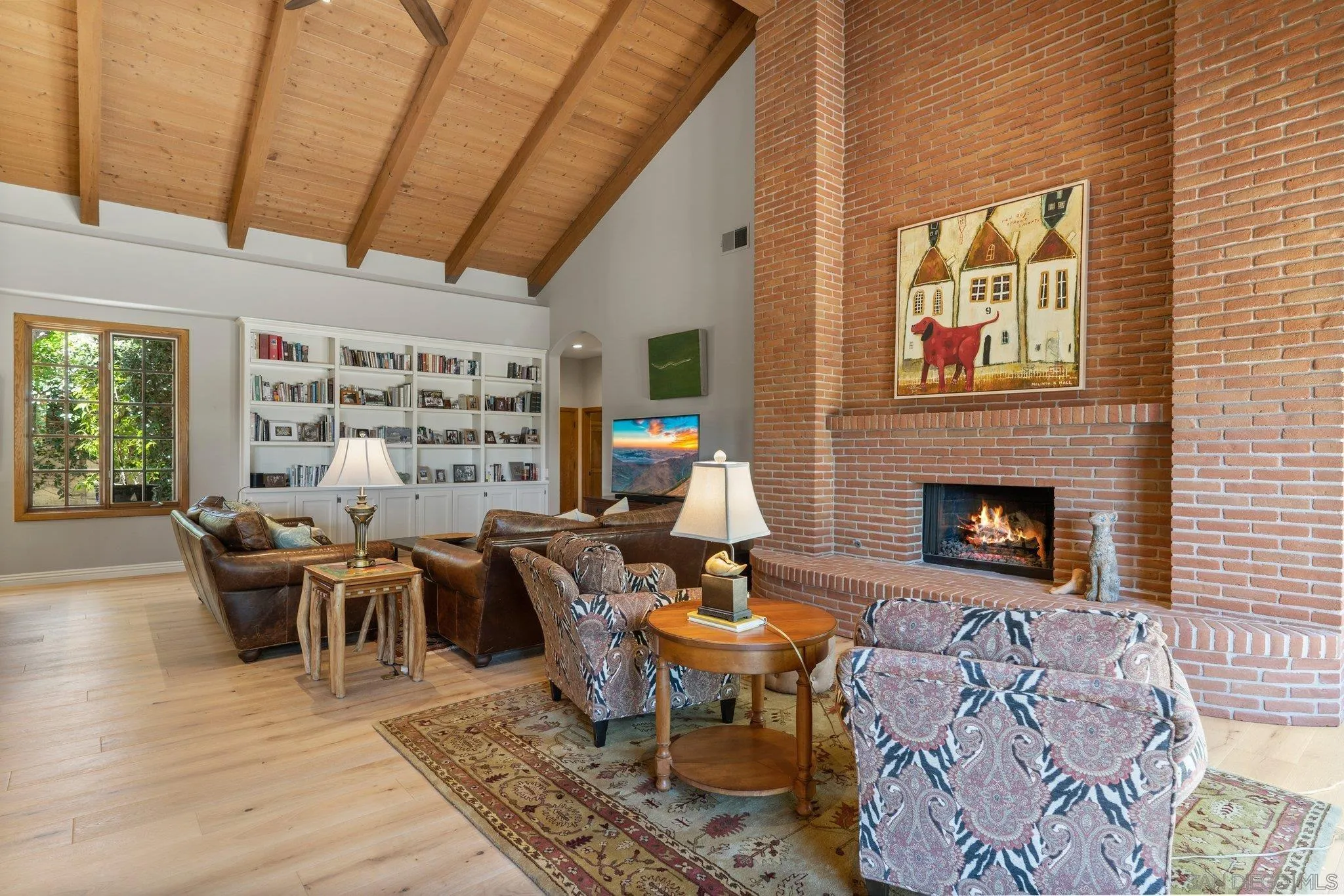 6286 Avenida Floresta Rancho Santa Fe, CA 92067 - Photo 43 of 69 a living room with furniture a fireplace and a table