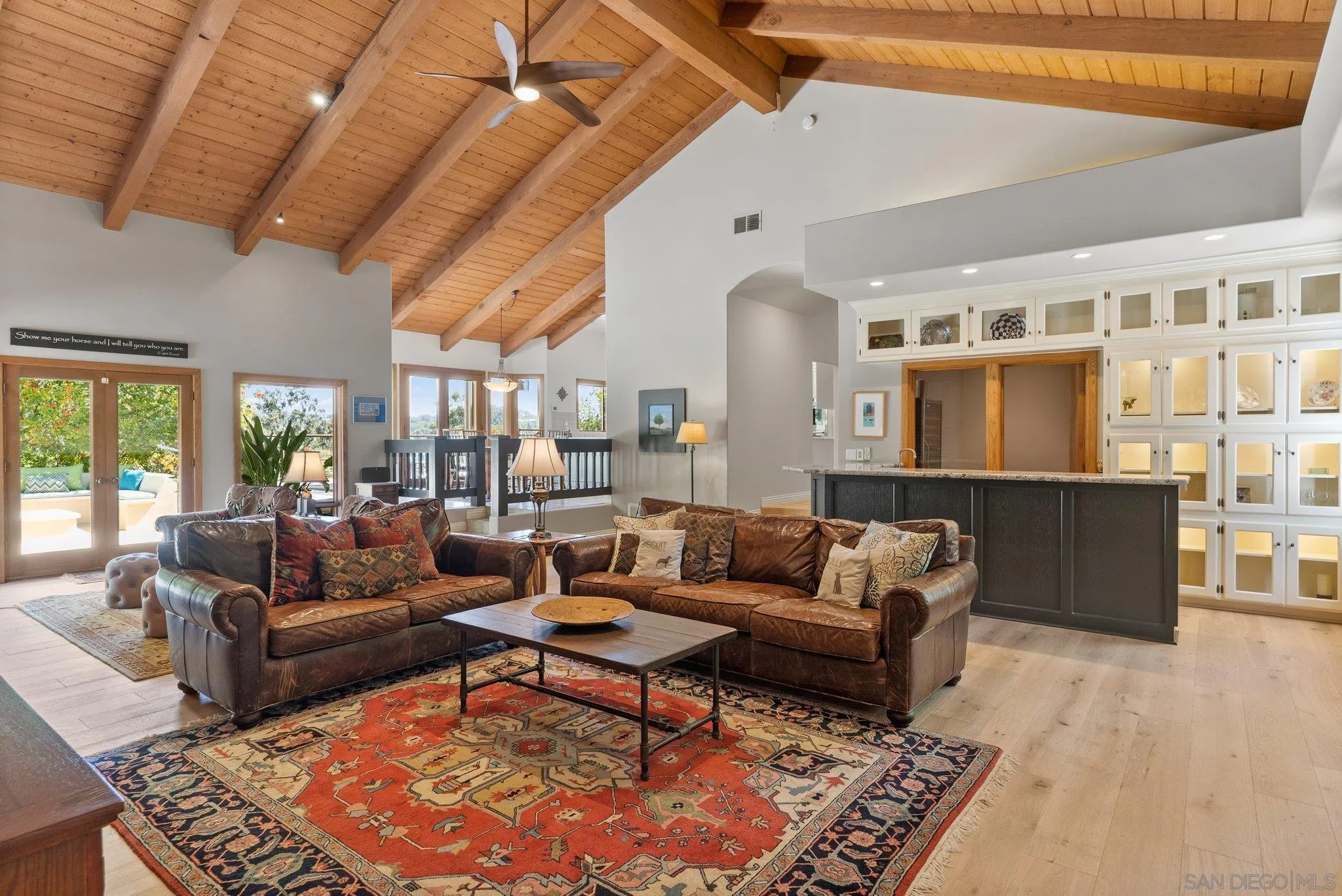 6286 Avenida Floresta Rancho Santa Fe, CA 92067 - Photo 44 of 69 a living room with furniture a rug and a chandelier