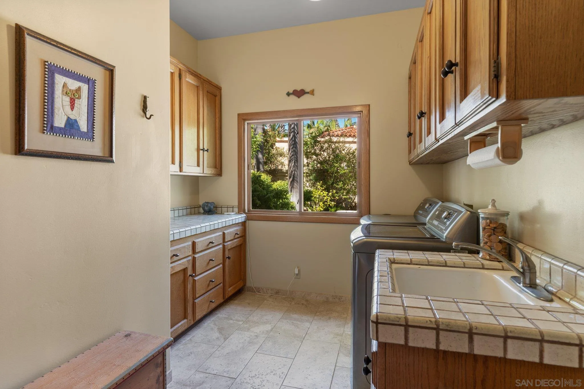 6286 Avenida Floresta Rancho Santa Fe, CA 92067 - Photo 52 of 69 a kitchen with stainless steel appliances granite countertop a stove and a sink