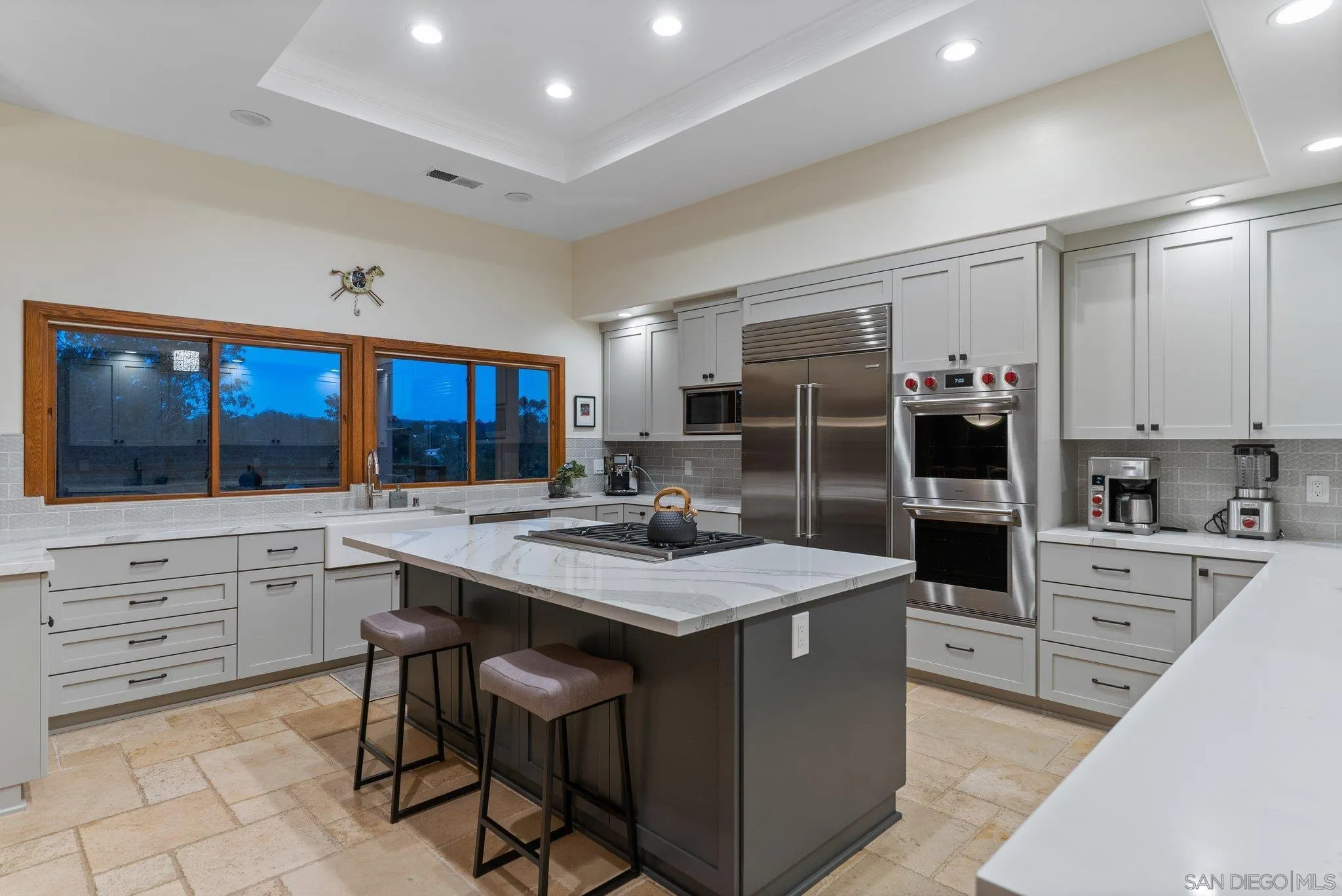 6286 Avenida Floresta Rancho Santa Fe, CA 92067 - Photo 58 of 69 a kitchen with stainless steel appliances kitchen island granite countertop a stove refrigerator and cabinets