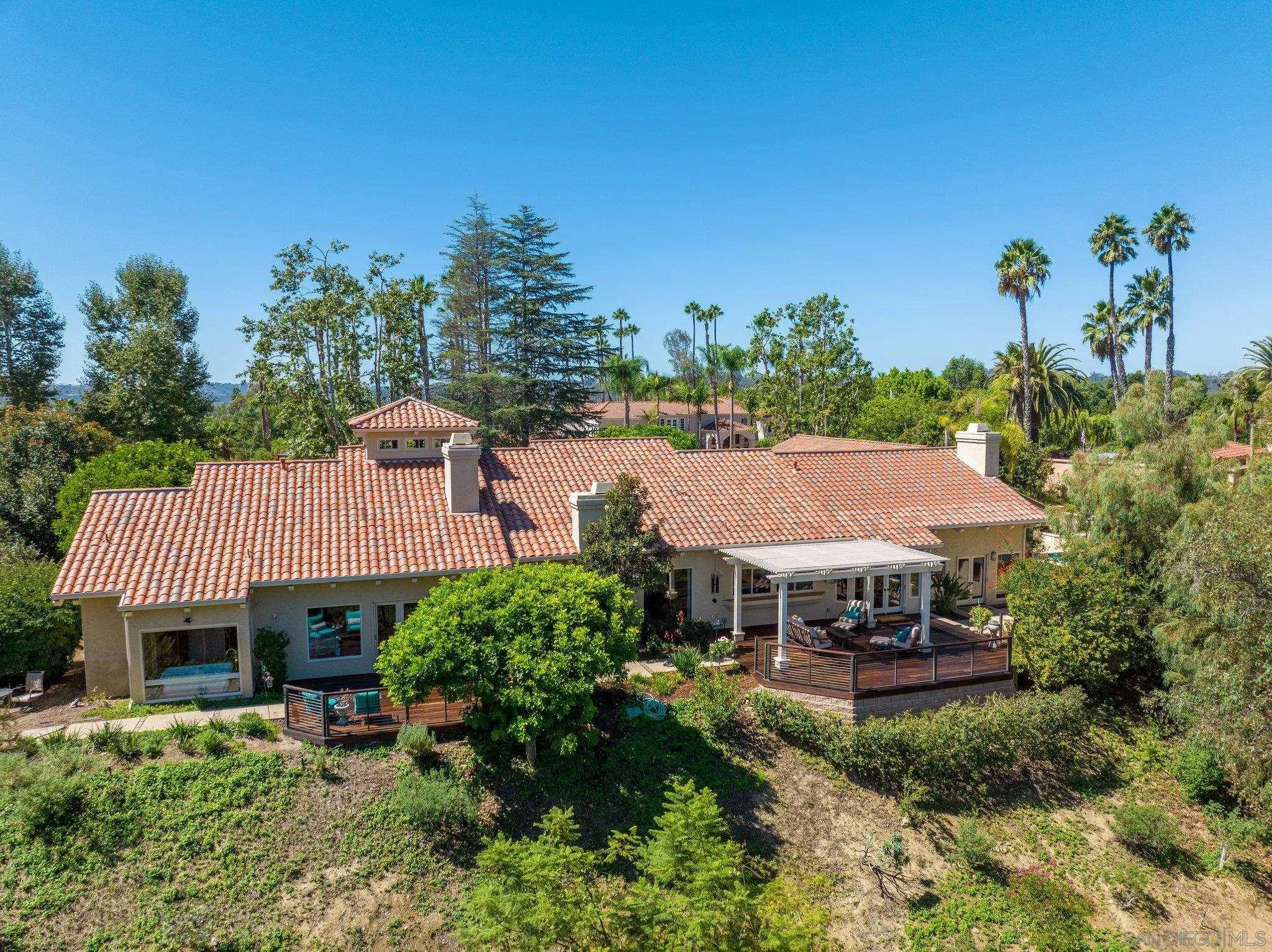 6286 Avenida Floresta Rancho Santa Fe, CA 92067 - Photo 7 of 69 a view of a house with a patio and a yard