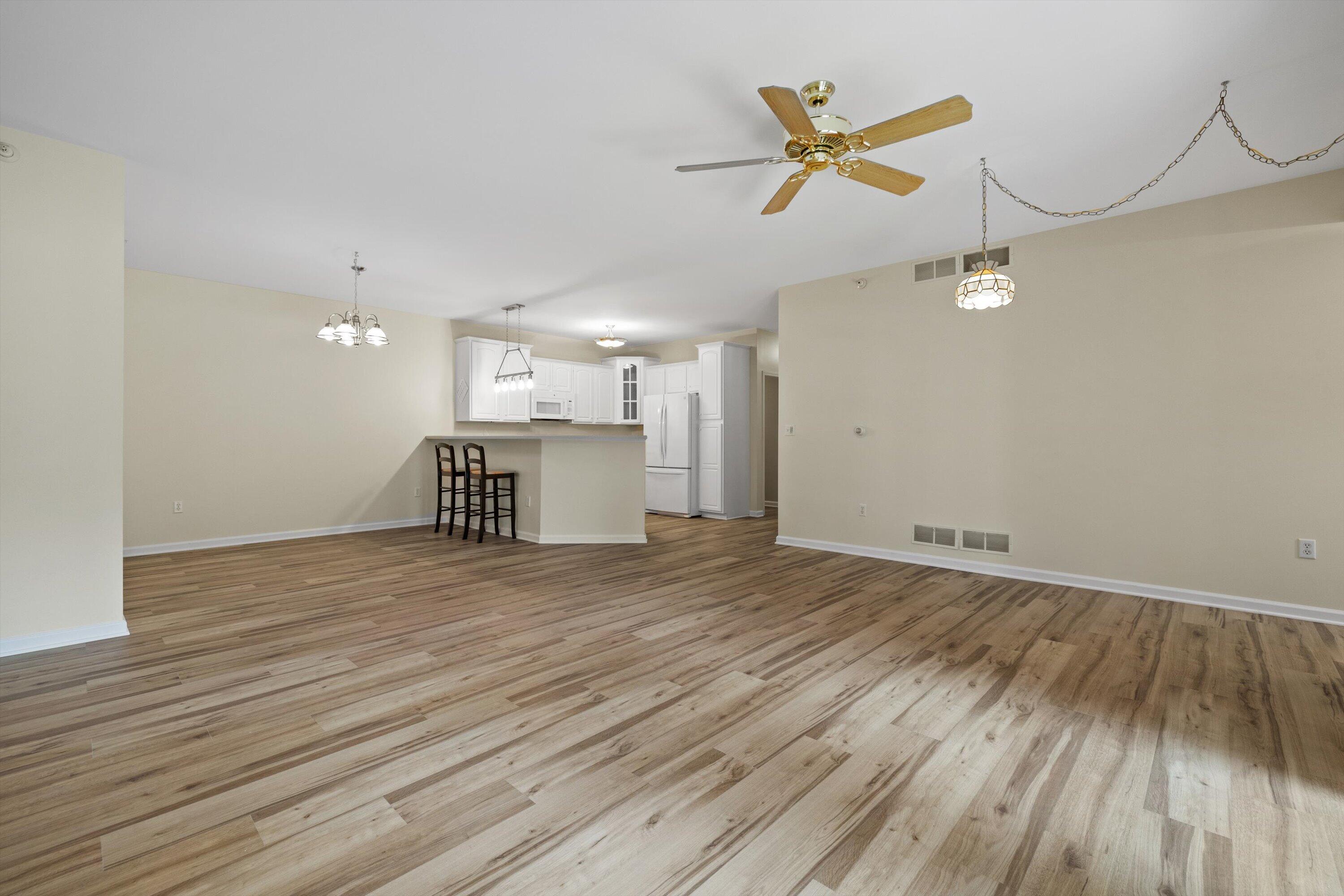 6510 Spring Street, Unit 12 Mount Pleasant, WI 53406 - Photo 6 of 26 LR, DR view to Kitchen