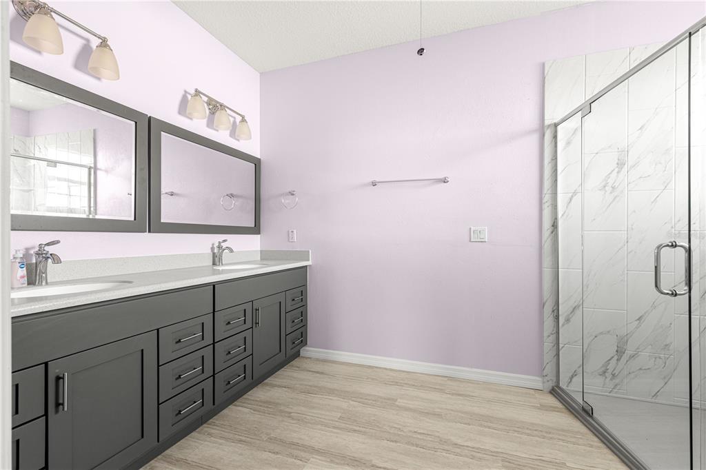 8084 South W 81st Loop Ocala, FL 34476 - Photo 19 of 37 a bathroom with a double vanity sink mirror and double