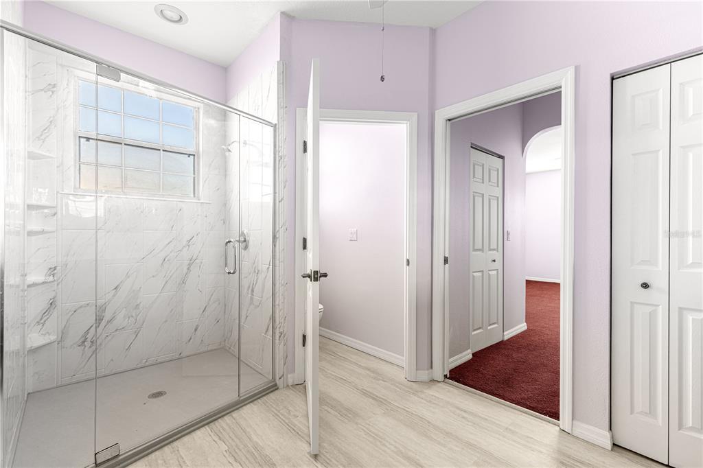 8084 South W 81st Loop Ocala, FL 34476 - Photo 20 of 37 a bathroom with a glass shower door