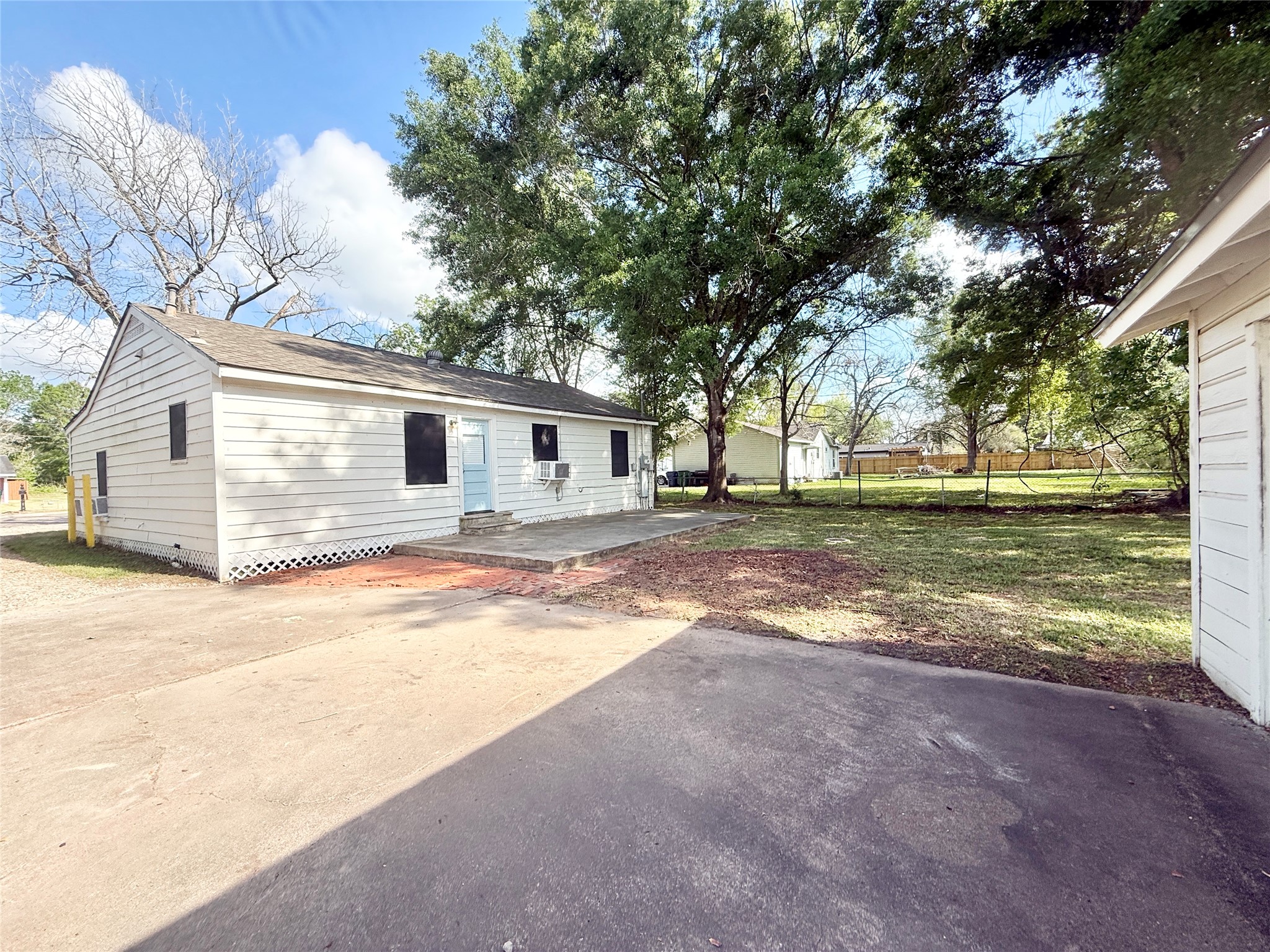 832 South Anderson Street Angleton, TX 77515 - Photo 18 of 19 a view of a house with backyard and a tree