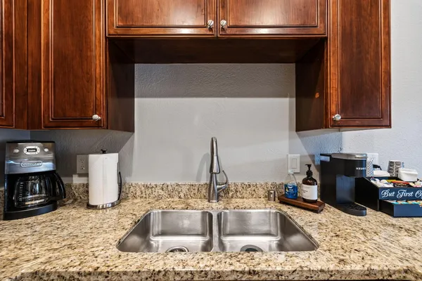 a kitchen with a stove and a sink