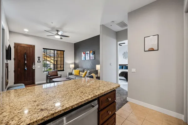 a view of living room with granite countertop furniture and fireplace