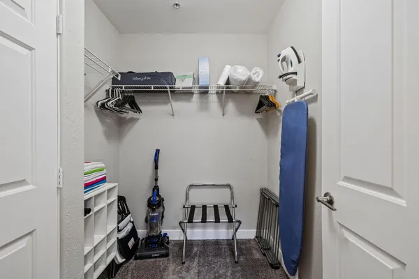 a view of storage and utility room with racks on the wall