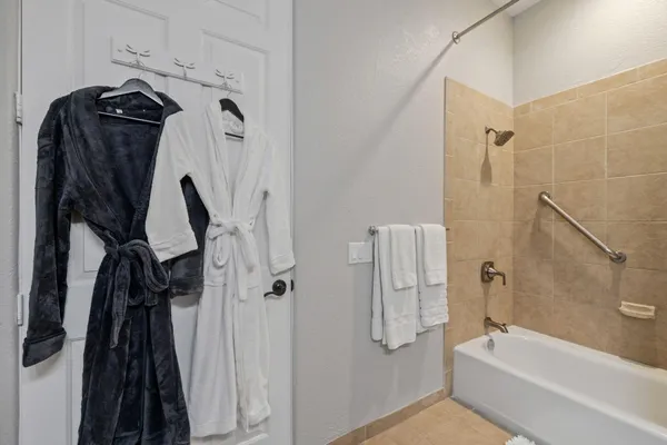 a bathroom with a tub and a shower