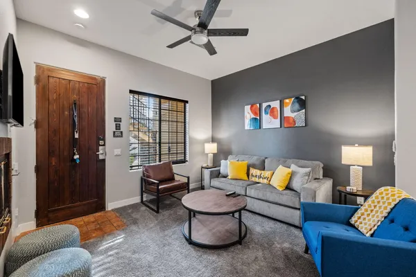 a living room with furniture and a flat screen tv