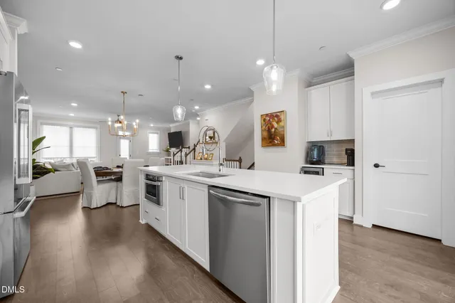 a kitchen with a sink and a stove top oven
