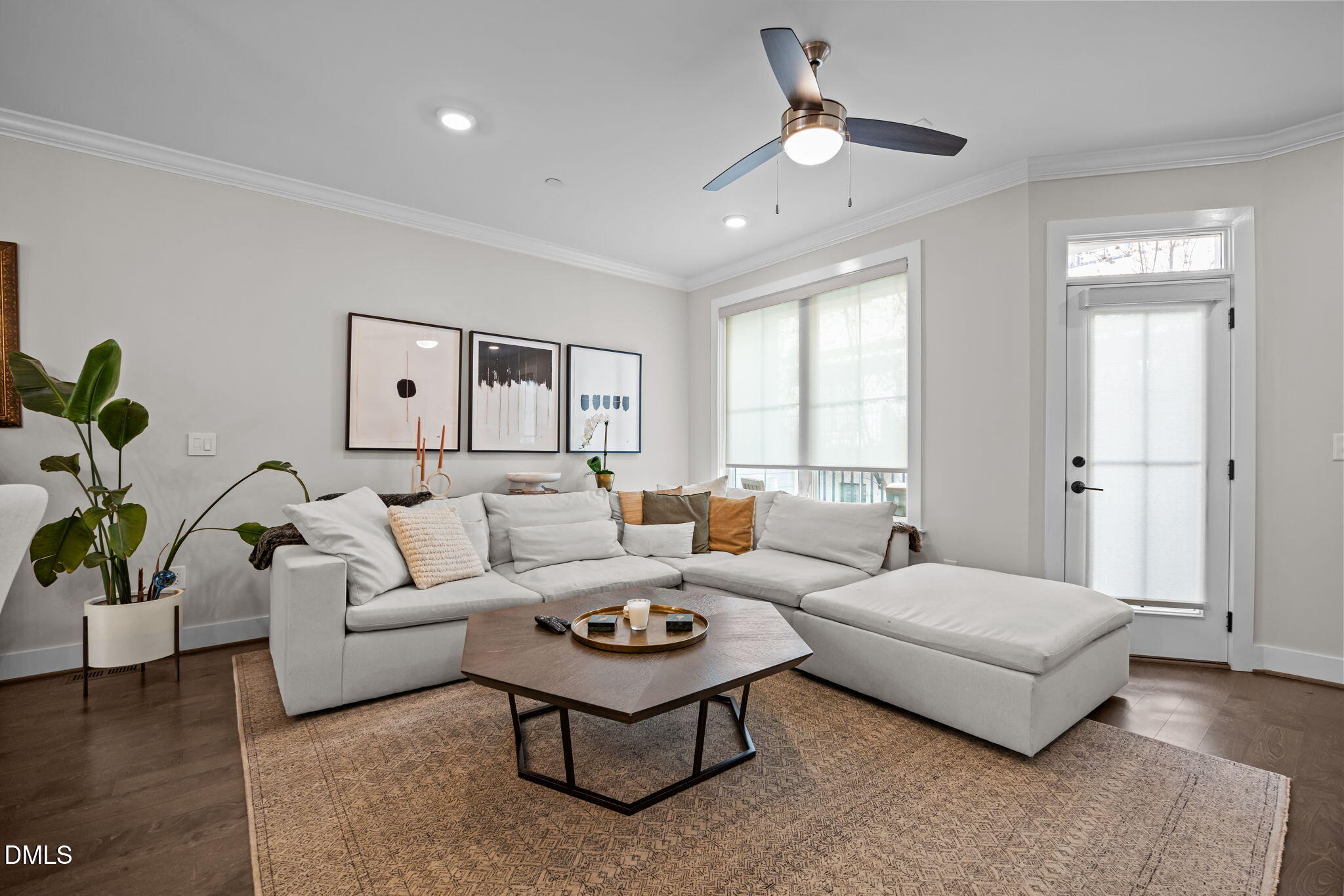 401 Bryan Pointe Drive, Unit 103 Raleigh, NC 27608 - Photo 20 of 43 a living room with furniture and a large window