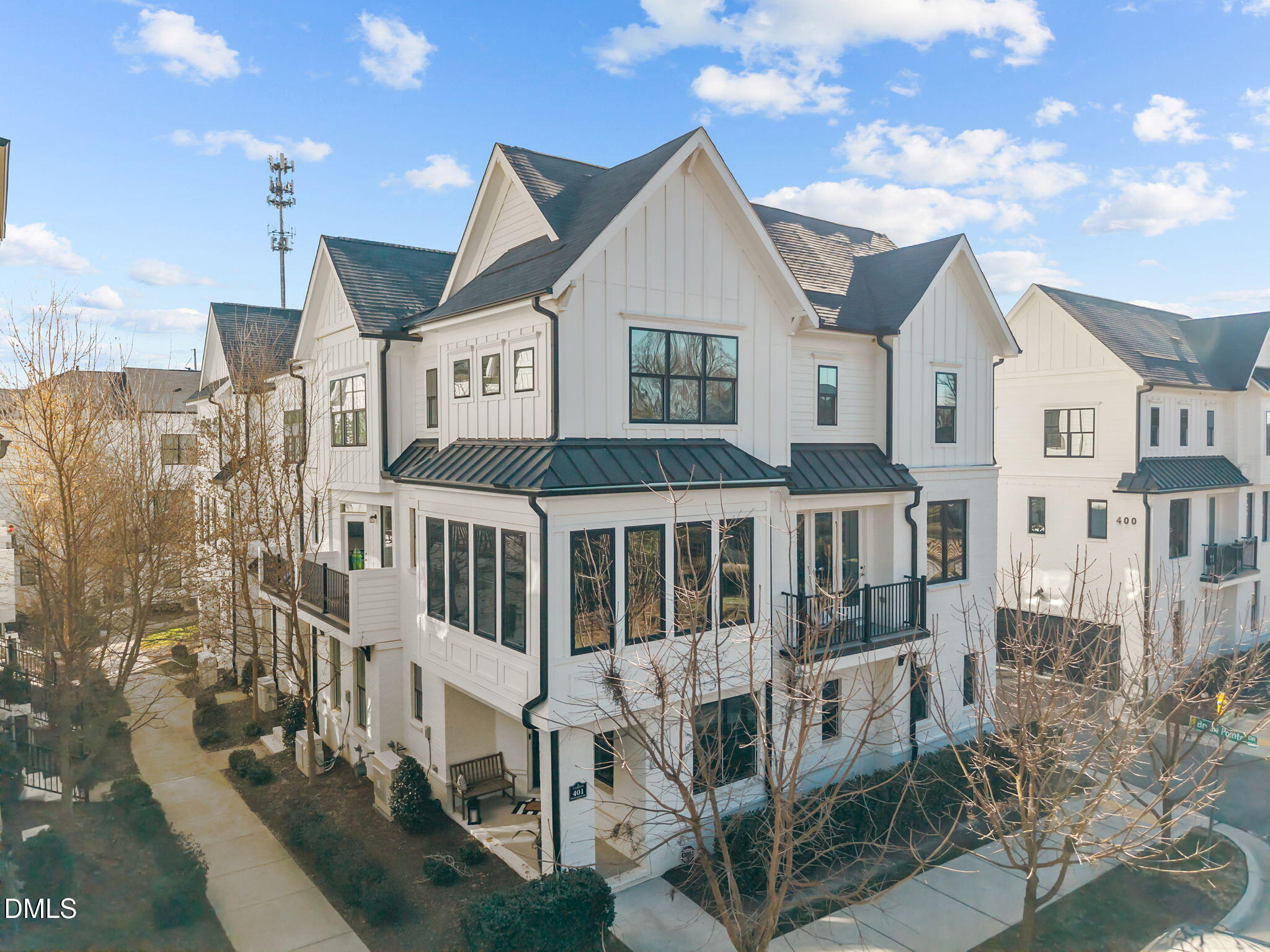 401 Bryan Pointe Drive, Unit 103 Raleigh, NC 27608 - Photo 2 of 43 a view of a large building with a lot of windows