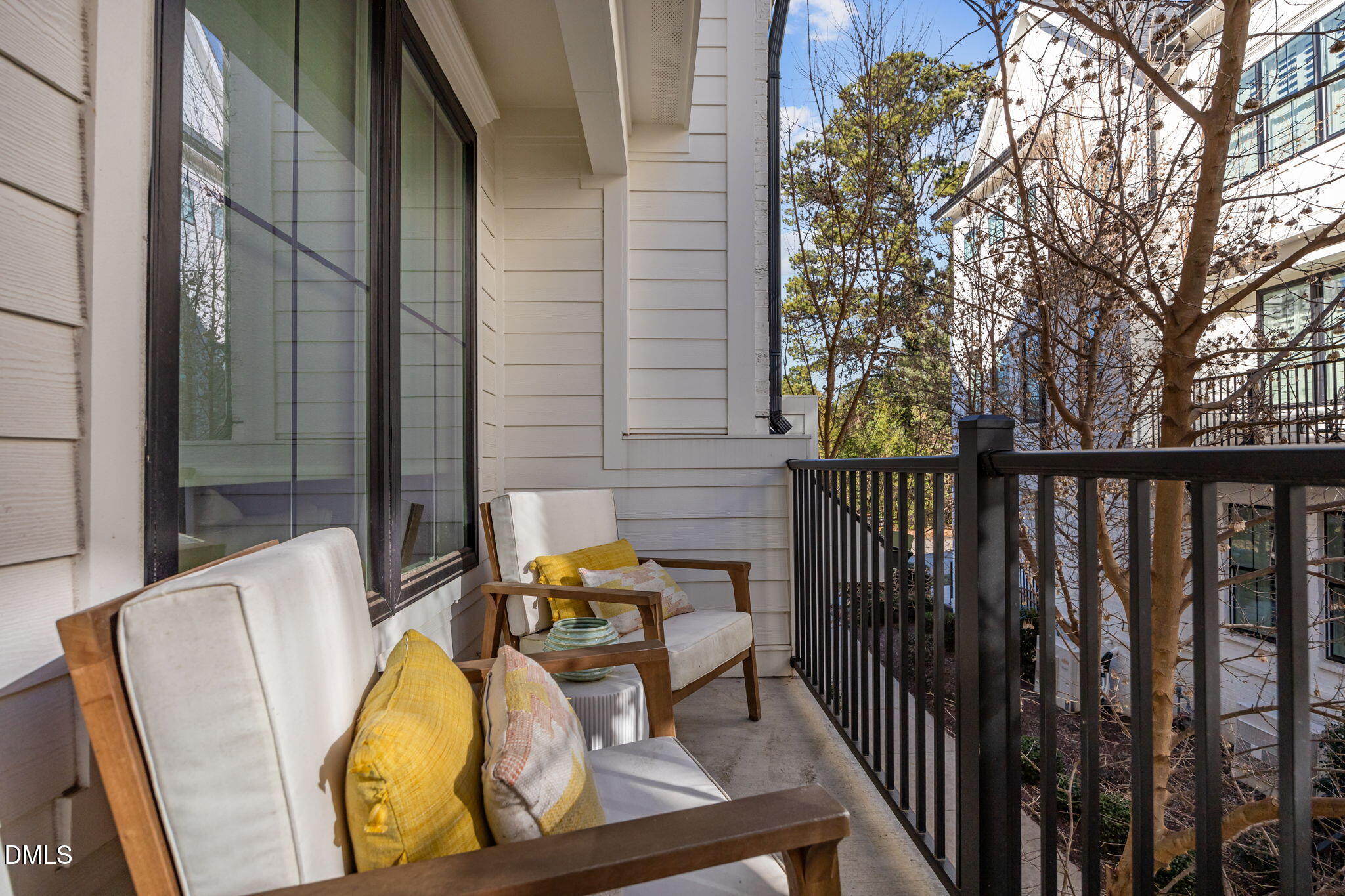 401 Bryan Pointe Drive, Unit 103 Raleigh, NC 27608 - Photo 25 of 43 a view of balcony with two chairs and a potted plant