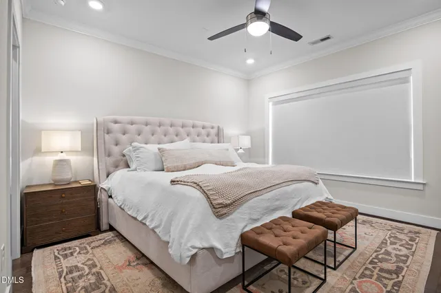 a bedroom with a bed and chair