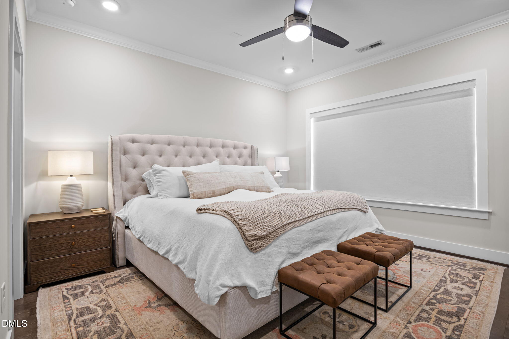 401 Bryan Pointe Drive, Unit 103 Raleigh, NC 27608 - Photo 29 of 43 a bedroom with a bed and chair