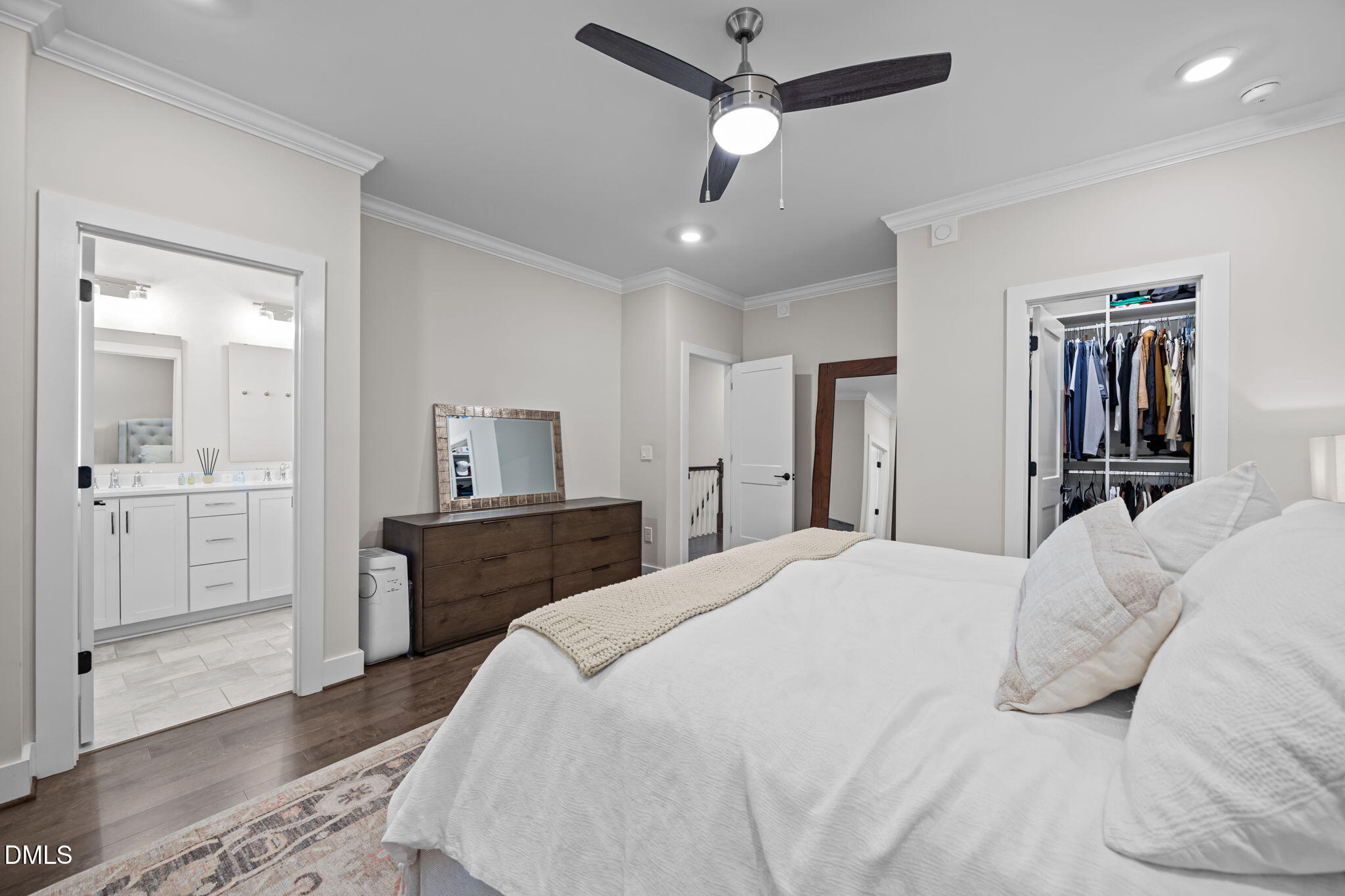 401 Bryan Pointe Drive, Unit 103 Raleigh, NC 27608 - Photo 30 of 43 a bedroom with a bed and a dresser