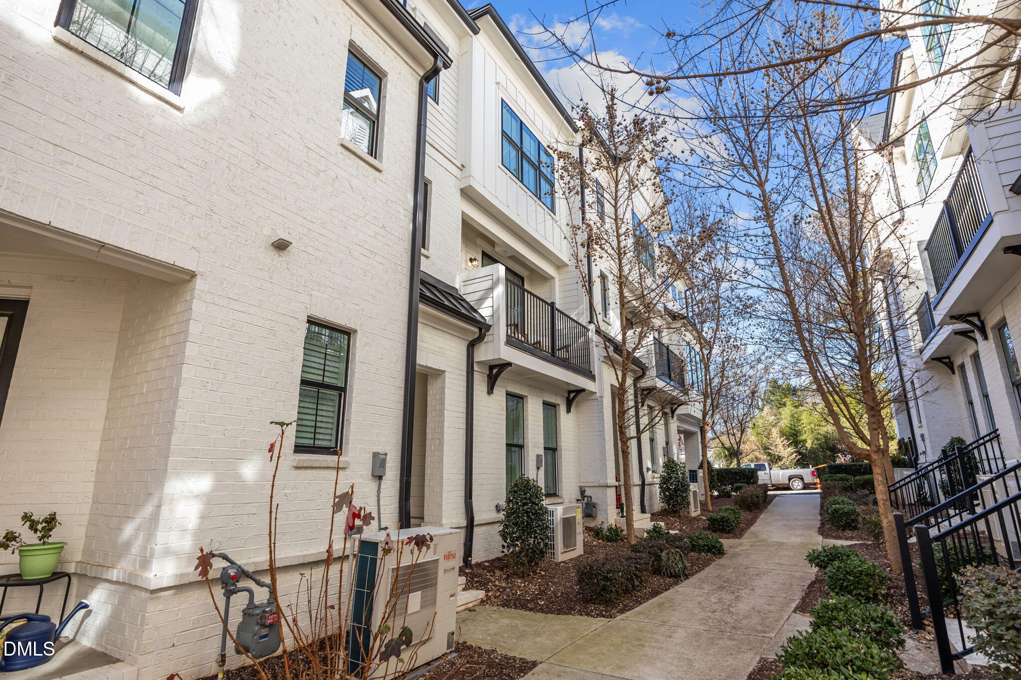 401 Bryan Pointe Drive, Unit 103 Raleigh, NC 27608 - Photo 3 of 43 a view of a building with many windows