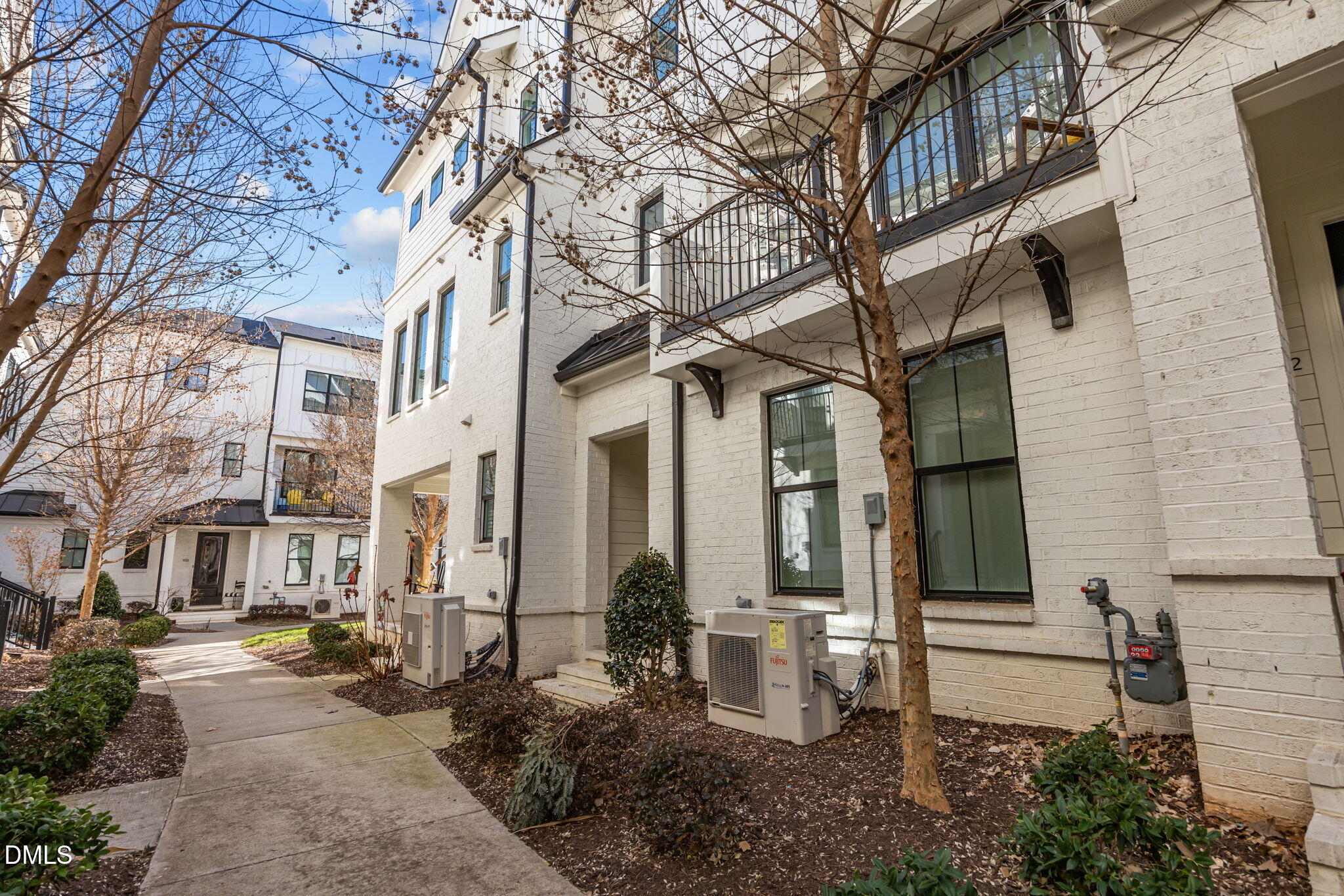 401 Bryan Pointe Drive, Unit 103 Raleigh, NC 27608 - Photo 4 of 43 a view of a building with many windows